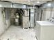 Unfinished basement with laundry hookups and utilities at 114 N Oriental St, Indianapolis, IN 46202