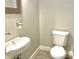 Clean and simple bathroom with white toilet and sink at 114 N Oriental St, Indianapolis, IN 46202