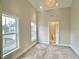 Bright bedroom with high ceilings and carpet at 114 N Oriental St, Indianapolis, IN 46202