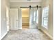 Bedroom with barn door and window at 114 N Oriental St, Indianapolis, IN 46202