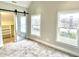 Spacious bedroom with barn door and windows at 114 N Oriental St, Indianapolis, IN 46202