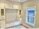 White built-in storage with glass doors and drawers at 114 N Oriental St, Indianapolis, IN 46202