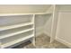White built-in shelving and hanging rod at 114 N Oriental St, Indianapolis, IN 46202
