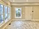 Bright dining area with tile floors and large windows at 114 N Oriental St, Indianapolis, IN 46202