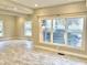 Open dining area with tile floors and large windows at 114 N Oriental St, Indianapolis, IN 46202