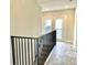 Hallway featuring double doors and a modern railing at 114 N Oriental St, Indianapolis, IN 46202