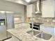 Modern kitchen featuring stainless steel appliances and granite countertops at 114 N Oriental St, Indianapolis, IN 46202