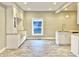 Spacious kitchen featuring granite countertops and white cabinets at 114 N Oriental St, Indianapolis, IN 46202