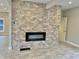 Living room with a modern fireplace and gray tile floors at 114 N Oriental St, Indianapolis, IN 46202