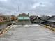 Spacious rooftop deck with city views and black railing at 114 N Oriental St, Indianapolis, IN 46202
