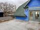 Blue house with rooftop deck and city views at 114 N Oriental St, Indianapolis, IN 46202