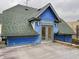 Blue house with rooftop deck and city views at 114 N Oriental St, Indianapolis, IN 46202