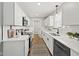 Modern kitchen featuring white cabinets, quartz countertops, and stainless steel appliances at 11930 Old Orchard Dr, Indianapolis, IN 46236