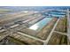 Aerial view of a new community development with ponds and homes at 1365 Foxtail Ln, Greenwood, IN 46143