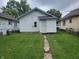House backyard with grassy lawn and walkway at 1445 W 34Th St, Indianapolis, IN 46208