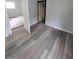 Bedroom with new wood-look flooring and gray walls at 1445 W 34Th St, Indianapolis, IN 46208