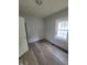 Bedroom with new wood-look flooring and gray walls at 1445 W 34Th St, Indianapolis, IN 46208