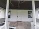 Front porch with white painted walls and concrete flooring at 1445 W 34Th St, Indianapolis, IN 46208