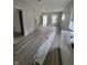 Living room with new wood-look flooring and gray walls at 1445 W 34Th St, Indianapolis, IN 46208