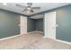 Finished basement bedroom with ceiling fan and carpet flooring at 16172 Sedalia Dr, Fishers, IN 46040