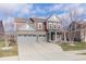 Two-story home with gray and red siding, attached two-car garage, and landscaping at 16172 Sedalia Dr, Fishers, IN 46040