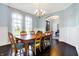 Bright dining room with wood table and chairs, and chandelier at 16845 Downstream Dr, Westfield, IN 46062