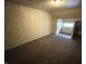 Bedroom with carpet, textured walls, and a window at 2817 N New Jersey St, Indianapolis, IN 46205