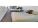 Spacious bedroom featuring two beds, neutral colored walls and a carpeted floor at 304 N College Ave # Apt A, Indianapolis, IN 46202