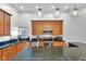 Modern kitchen showcasing granite counters, stainless appliances, and stylish pendant lights at 304 N College Ave # Apt A, Indianapolis, IN 46202