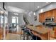 Open kitchen with granite countertops, stainless steel appliances, and seamless access to dining and living areas at 304 N College Ave # Apt B, Indianapolis, IN 46202