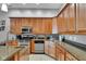 Fully equipped kitchen with granite countertops, stainless steel appliances, and abundant storage at 304 N College Ave # Apt B, Indianapolis, IN 46202