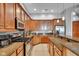Modern kitchen with stainless steel appliances, granite countertops, and ample cabinet space at 304 N College Ave # Apt B, Indianapolis, IN 46202