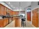 Spacious kitchen with stainless steel appliances, granite countertops, and breakfast bar with seating at 304 N College Ave # Apt B, Indianapolis, IN 46202