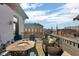 This stunning outdoor deck offers a gas firepit, ample seating, and amazing elevated views at 304 N College Ave # Apt B, Indianapolis, IN 46202