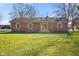 Ranch house with brick exterior, sliding glass doors, and a large lawn at 3699 Lisa Ln, Plainfield, IN 46168