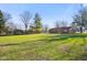 Large backyard with green grass and mature trees at 3699 Lisa Ln, Plainfield, IN 46168