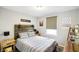 Bedroom with rustic wood headboard and striped bedding at 3699 Lisa Ln, Plainfield, IN 46168