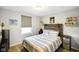 Spacious bedroom with a rustic wood headboard, striped bedding, and ample storage at 3699 Lisa Ln, Plainfield, IN 46168