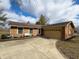 Lovely brick home with attached garage, complemented by mature trees and a concrete driveway at 3699 Lisa Ln, Plainfield, IN 46168