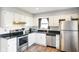 Modern kitchen with stainless steel appliances and dark countertops at 3699 Lisa Ln, Plainfield, IN 46168