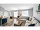 Living room with sectional sofa and large windows at 3699 Lisa Ln, Plainfield, IN 46168