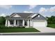 Craftsman style home with gray siding, white trim, and a two-car garage at 4602 White Willow Way, New Palestine, IN 46163
