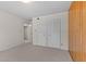 Bedroom with wood-paneled wall and large closet at 5038 Allisonville Rd # A, Indianapolis, IN 46205