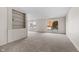 Living room with built-in shelving and large windows at 5038 Allisonville Rd # A, Indianapolis, IN 46205