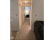 Long hallway with carpeted floors and access to bedrooms at 5051 W 57Th St, Indianapolis, IN 46254