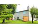 Spacious backyard with privacy fence, mature trees, and outdoor living area at 5340 Thompson Park Blvd, Indianapolis, IN 46237