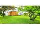 Large backyard with new privacy fence, mature trees, and green lawn at 5340 Thompson Park Blvd, Indianapolis, IN 46237