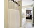 Bathroom with shower, bathtub, and view of bedroom at 5340 Thompson Park Blvd, Indianapolis, IN 46237