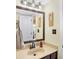 Clean bathroom with updated vanity and mirror at 5340 Thompson Park Blvd, Indianapolis, IN 46237