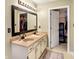 Bathroom with double sinks, vanity, and linen closet at 5340 Thompson Park Blvd, Indianapolis, IN 46237